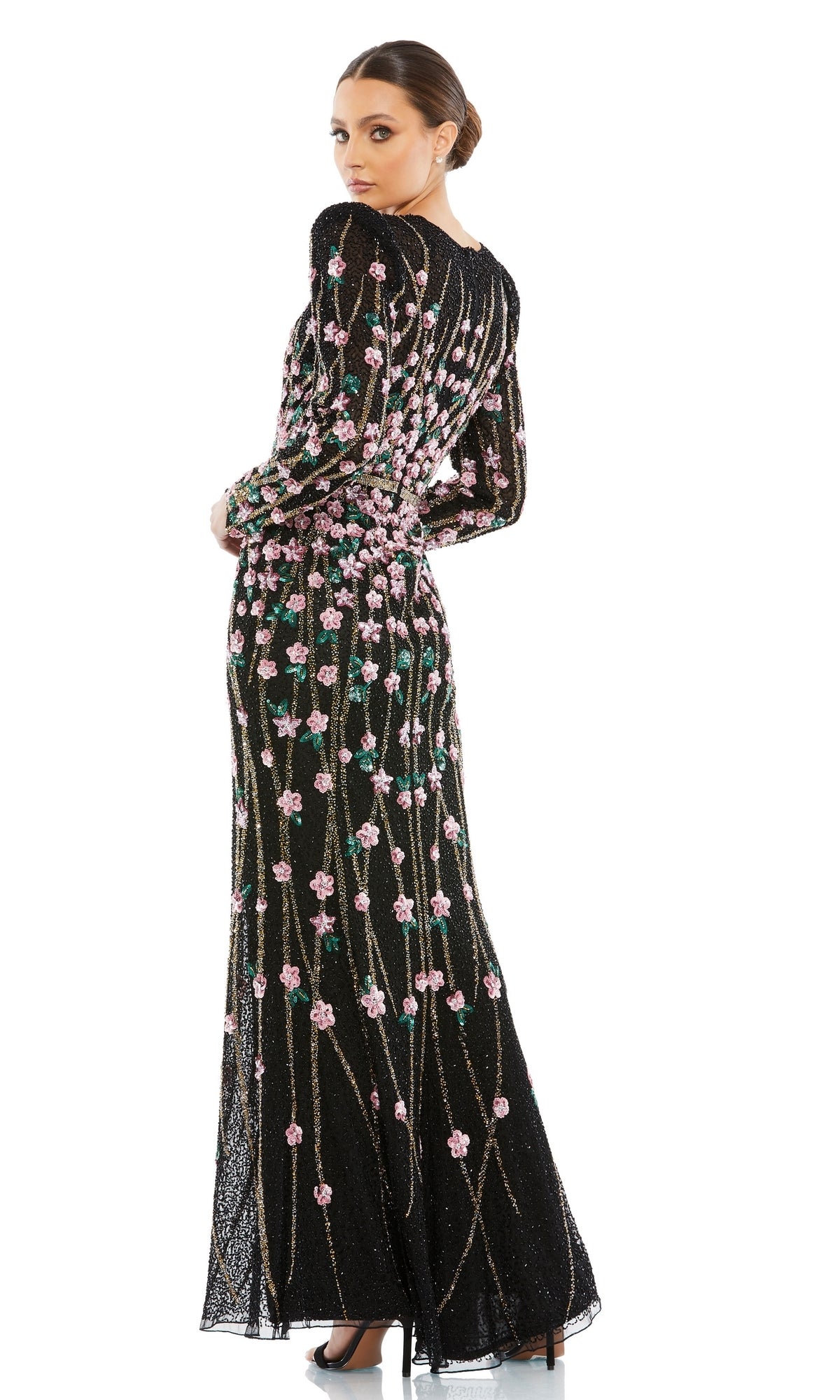 Woman wearing the Beaded Long Black Formal Dress, Mac Duggal 5492, standing and looking over her shoulder against a white background.